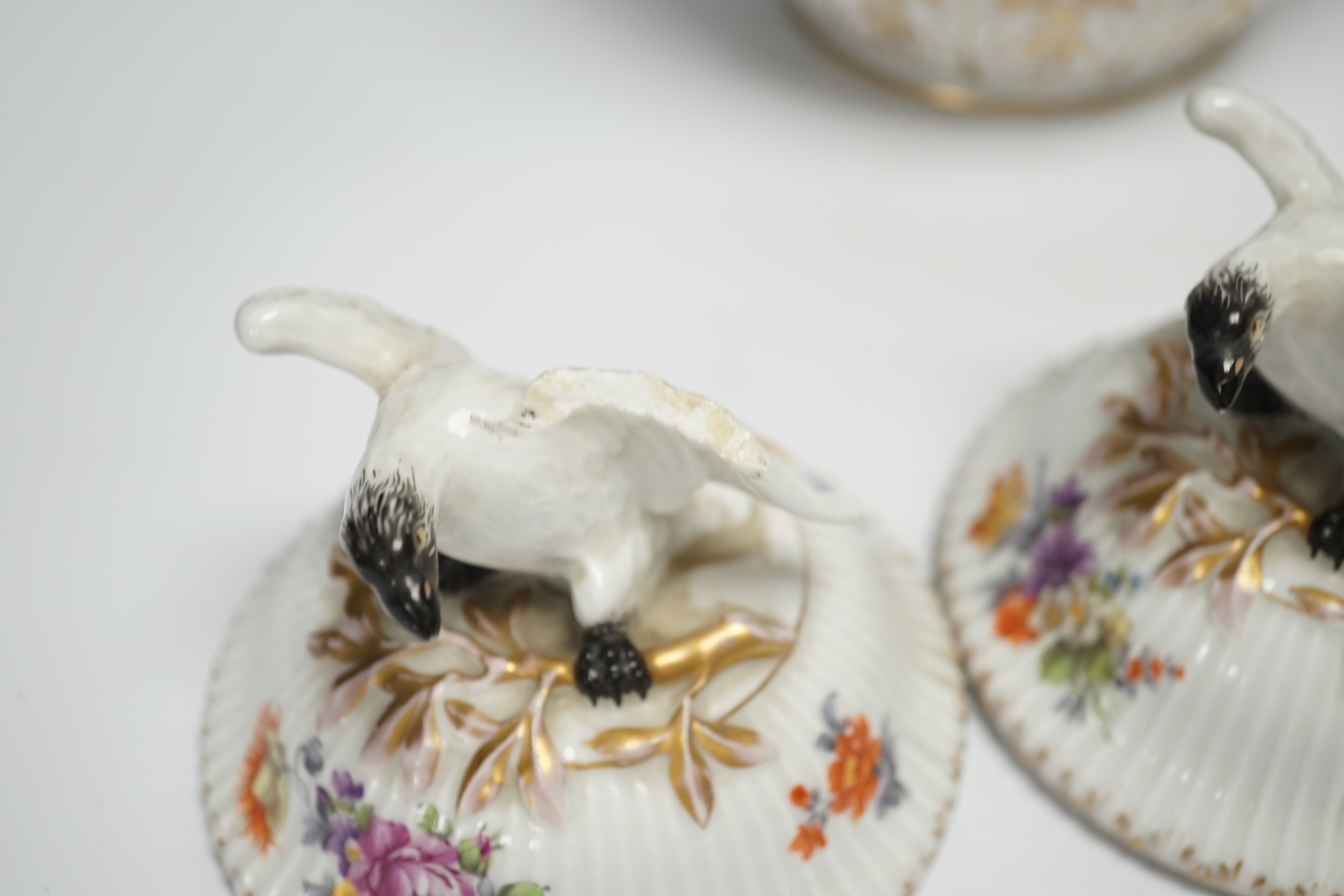 A pair of Continental floral decorated ribbed jars and covers with figural cartouches, 32cm high